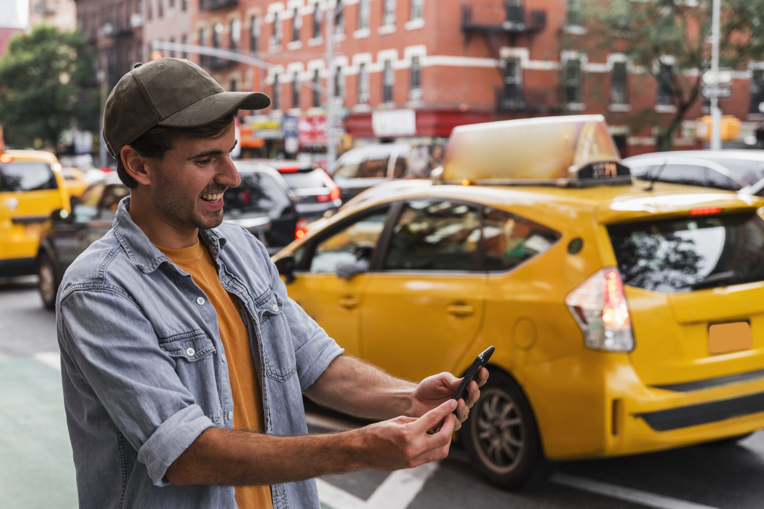 smiley-man-city-holding-mobile